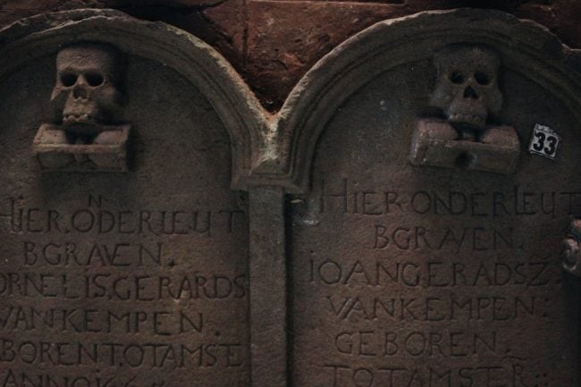 Dutch tombstones lay on the floor in the tombstone room. Image courtesy writer