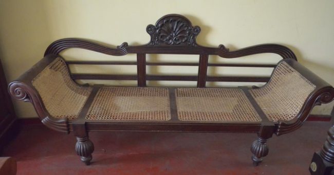 An antique wooden couch. Image credit: srilankaantiques.com