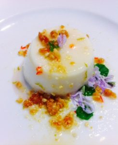 One of Kumar's creations, and a definite summer delight: coconut water and cashew panna cotta with chili lime syrup, kithul treacle salted praline. Photo credit: Kumar Pereira. Insta @kumarpereira