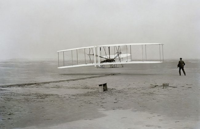 The iconic photograph capturing the first flight of the famous Wright Flyer. Credits: Wikipedia.org