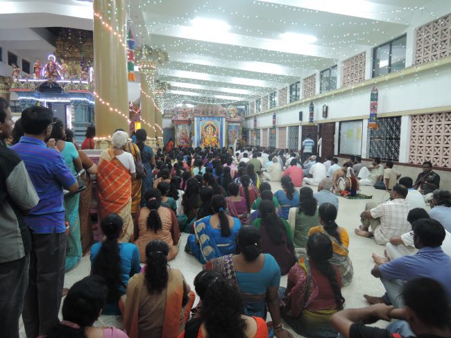 Devotees at a special morning pooja for Kanda Shasti at Bambalapitiya Kathiresan Kovil.