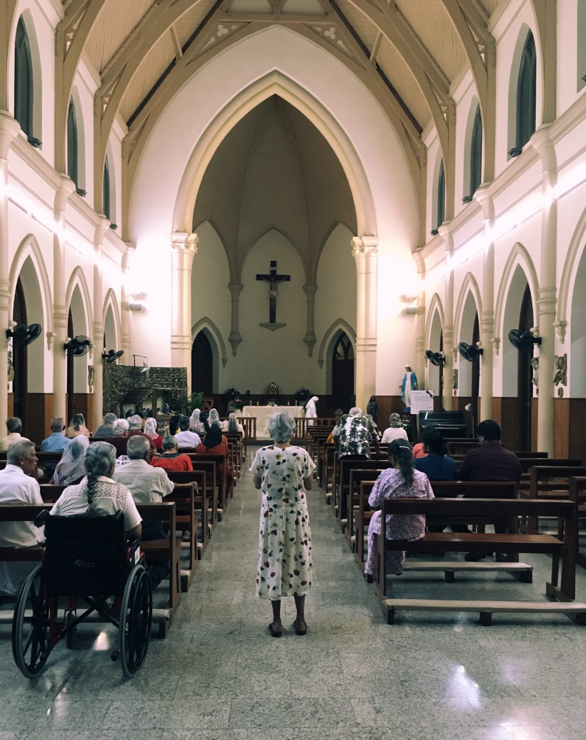 The residents at St. Mary's Home for the Elderly run by the Little Sisters of the Poor off Darley Road, Maradana, gather for midnight mass. Image courtesy: Minaali Haputantri / Roar.lk