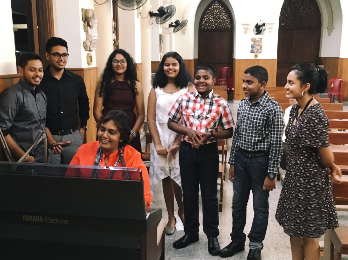 Priyanthi, a music teacher, and her family – as well as a few of her students – sing for midnight mass at St. Mary’s on a volunteer basis, in an attempt at spreading the Christmas cheer. Image courtesy: Priyanthi Seneviratne Van Dort 