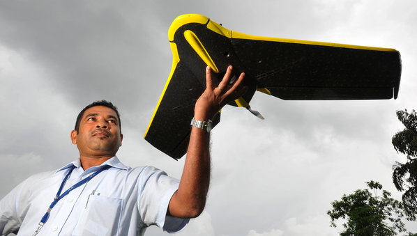 Ranjith Alankara with the IWMI drone for a test flight near Colombo, Sri Lanka Credit: Neil Palmer / IWMI