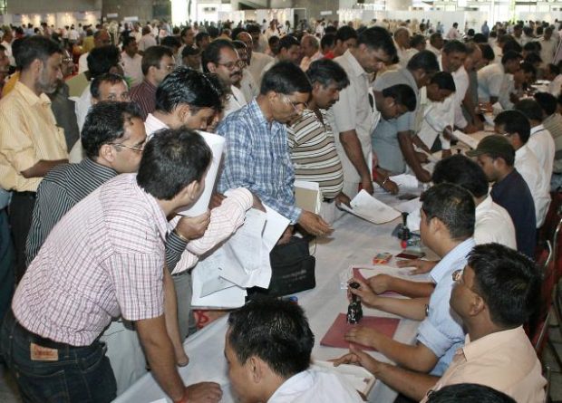 Individuals queue up to file their tax returns in India. Image credit: The Hindu