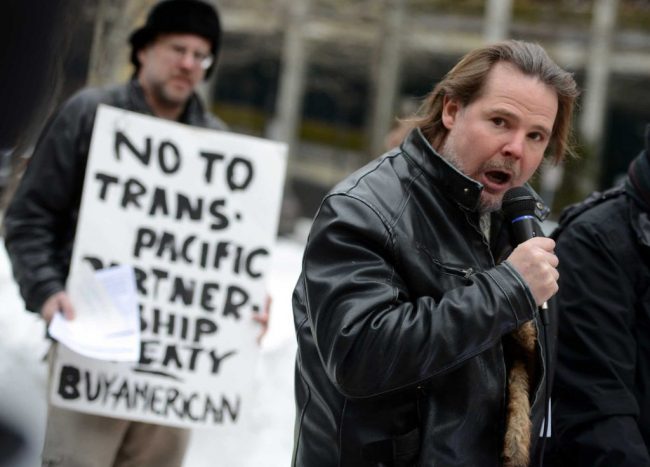  A small group protesting against the recently signed Trans Pacific Partnership (TPP). Image credit: CT Post